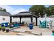 Backyard gazebo with comfortable seating, colorful decor, and a stylish design at 9964 N Chestnut St, Middlesex, NC 27557