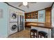 Modern kitchen with an island, bar seating, and stainless steel appliances at 9964 N Chestnut St, Middlesex, NC 27557
