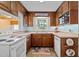Functional kitchen with wood cabinets, and modern appliances at 9964 N Chestnut St, Middlesex, NC 27557
