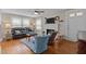 Comfortable living room featuring a brick fireplace and plenty of natural light at 9964 N Chestnut St, Middlesex, NC 27557