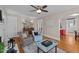 Spacious living room with hardwood floors, neutral walls, and cozy seating area at 9964 N Chestnut St, Middlesex, NC 27557