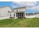 Large, grassy backyard with privacy fence, perfect for outdoor gatherings and recreational activities at 100 Emory Bluffs Dr, Holly Springs, NC 27540
