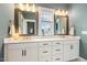 Bathroom features a double vanity, quartz countertop, and great lighting at 100 Emory Bluffs Dr, Holly Springs, NC 27540
