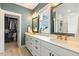 Bathroom with double vanity, walk-in closet, and elegant fixtures at 100 Emory Bluffs Dr, Holly Springs, NC 27540