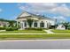 Inviting community clubhouse with manicured landscaping, offering a welcoming space for residents at 100 Emory Bluffs Dr, Holly Springs, NC 27540