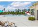 A view of the large community pool with plenty of lounge chairs and umbrellas at 100 Emory Bluffs Dr, Holly Springs, NC 27540