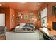 Comfortable home office featuring modern desk and sofa with stylish decor at 100 Emory Bluffs Dr, Holly Springs, NC 27540