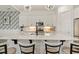 Close-up of kitchen island featuring quartz countertop and pendant lighting at 100 Emory Bluffs Dr, Holly Springs, NC 27540