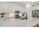 Well-equipped kitchen featuring stainless steel appliances and custom cabinetry at 100 Emory Bluffs Dr, Holly Springs, NC 27540