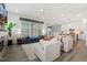 Spacious living room with an open layout, bright lighting, and modern furnishings at 100 Emory Bluffs Dr, Holly Springs, NC 27540