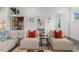 Stylish living room featuring modern furniture, built-in shelving, and a welcoming atmosphere at 100 Emory Bluffs Dr, Holly Springs, NC 27540