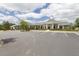 Exterior of community center with ample parking and pristine landscaping at 100 Emory Bluffs Dr, Holly Springs, NC 27540