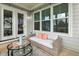 Charming patio with comfortable seating, glass table, and views of the outdoor space at 100 Emory Bluffs Dr, Holly Springs, NC 27540