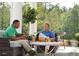 Inviting outdoor patio with comfortable seating, perfect for entertaining at 100 Emory Bluffs Dr, Holly Springs, NC 27540