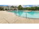 Gorgeous community pool with ample seating and sunbathing area at 100 Emory Bluffs Dr, Holly Springs, NC 27540