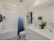 Modern bathroom with double sink vanity, a shower-tub combo, and a neutral color scheme at 100 Reagan Crest Dr, Clayton, NC 27520