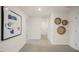 Bright hallway with neutral carpet, recessed lighting, and decorative wall art at 100 Reagan Crest Dr, Clayton, NC 27520