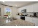 Spacious kitchen featuring granite countertops, stainless steel appliances, and modern cabinetry at 100 Reagan Crest Dr, Clayton, NC 27520