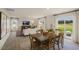 Bright open concept living and dining area with modern decor and an adjacent outdoor patio at 100 Reagan Crest Dr, Clayton, NC 27520