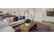 A modern living room featuring a plush white sofa, rustic coffee table, and vibrant artwork at 100 Reagan Crest Dr, Clayton, NC 27520