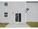 The backyard features a patio and gray siding with a satellite dish at 1004 Summer Mist Ln, Durham, NC 27704