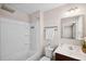 A bathroom featuring a white tub and a modern sink at 1004 Summer Mist Ln, Durham, NC 27704