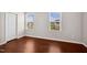 A bedroom showcasing two windows and a closet at 1004 Summer Mist Ln, Durham, NC 27704