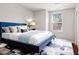 A stylish bedroom with a large bed, decorative pillows, and soft lighting at 1004 Summer Mist Ln, Durham, NC 27704