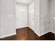 The bright entryway features hardwood floors and a classic white front door at 1004 Summer Mist Ln, Durham, NC 27704