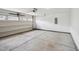 An empty two-car garage with a neutral walls and a functional garage door at 1004 Summer Mist Ln, Durham, NC 27704