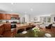 Modern kitchen with stainless steel appliances, granite counters, and open layout to living room at 1004 Summer Mist Ln, Durham, NC 27704