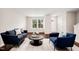 Stylish living room featuring dark wood floors, neutral walls, and elegant decor at 1004 Summer Mist Ln, Durham, NC 27704