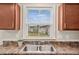 An empty living room with a view to the yard at 1004 Summer Mist Ln, Durham, NC 27704