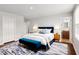 Comfortable main bedroom suite with a blue bed and ensuite bathroom at 1004 Summer Mist Ln, Durham, NC 27704