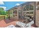 Expansive deck featuring outdoor seating and views of the well-manicured backyard and home's architectural details at 104 Cedar Ridge Way, Durham, NC 27705