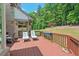 Spacious deck with comfortable seating and a serene view of the surrounding greenery at 104 Cedar Ridge Way, Durham, NC 27705