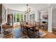 Elegant dining room featuring a large bay window, wood floors and trim at 104 Cedar Ridge Way, Durham, NC 27705