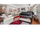 Elegant living space with hardwood floors, natural light, and a grand piano at 104 Cedar Ridge Way, Durham, NC 27705