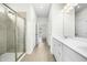 Bright bathroom with tile floors, double sinks and a glass-enclosed shower at 107 Altair Ln, Sanford, NC 27330