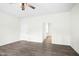 Spacious bedroom with wood-look floors, a ceiling fan and a closet for storage at 107 Altair Ln, Sanford, NC 27330