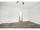 Bedroom with wood-look floors and a white door leading into a bathroom at 107 Altair Ln, Sanford, NC 27330
