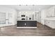 Modern kitchen with stainless steel appliances, granite countertops, and a stylish island at 107 Altair Ln, Sanford, NC 27330