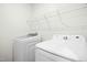 A bright laundry room features a Samsung washing machine and dryer at 107 Altair Ln, Sanford, NC 27330