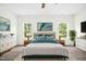 Well-lit main bedroom with neutral tones, decorative pillows, an area rug and a ceiling fan at 107 Altair Ln, Sanford, NC 27330