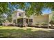 Back of the home featuring a wooden deck, screened porch, and a well-manicured lawn at 10909 Grand Journey Ave, Raleigh, NC 27614