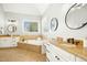 Bright bathroom features a soaking tub with tile surround, granite counters, and modern fixtures at 10909 Grand Journey Ave, Raleigh, NC 27614