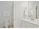 Clean bathroom features a white vanity, mirror, and a shower with white tiled wall at 10909 Grand Journey Ave, Raleigh, NC 27614