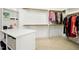 Walk-in closet with ample shelving, hanging space, and a central island for organization at 10909 Grand Journey Ave, Raleigh, NC 27614