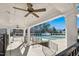 View of the community pool with a covered patio and ceiling fans overlooking the fenced pool area at 10909 Grand Journey Ave, Raleigh, NC 27614