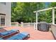 Wooden deck featuring outdoor seating and grill with access to the home and backyard at 10909 Grand Journey Ave, Raleigh, NC 27614